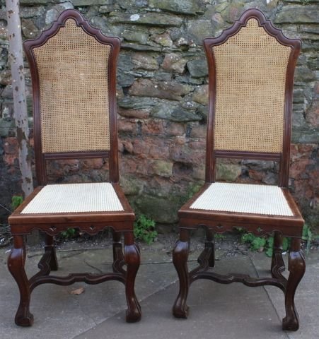 pair of walnut caned hall chairs