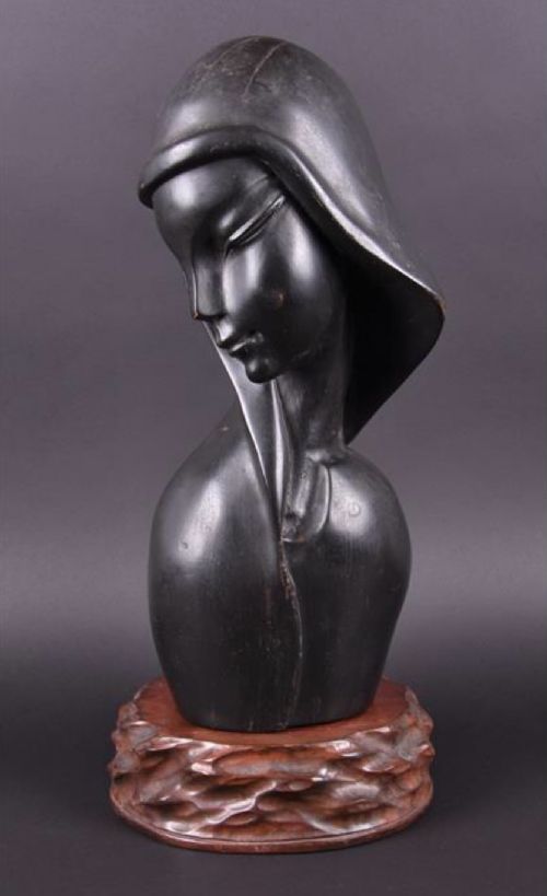 an art deco sculpture of a womans head