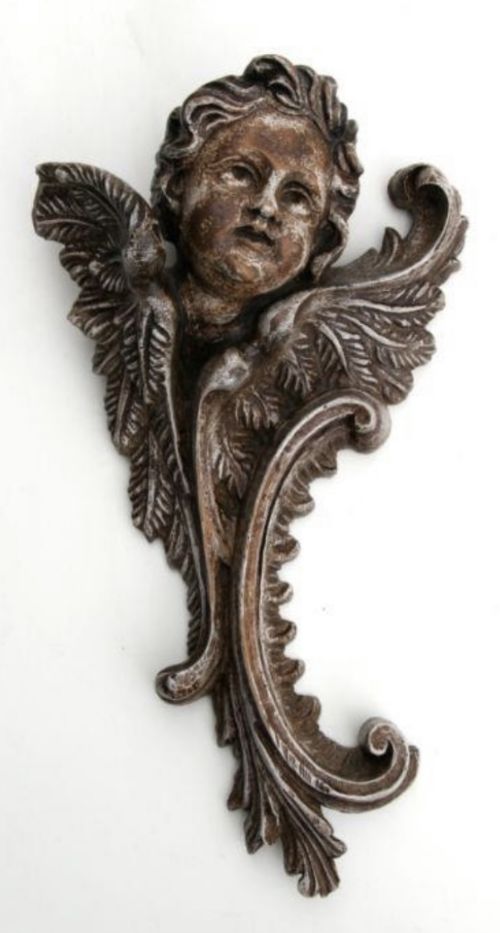 carved walnut cherub wall fragment
