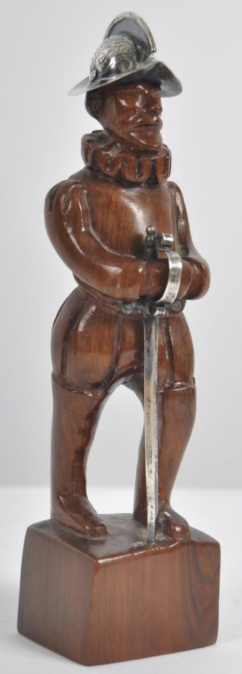 c19th carved wooden figure with silver helmet and sword