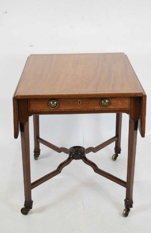 a georgian mahogany and satinwood pembroke table with x framed stretchers