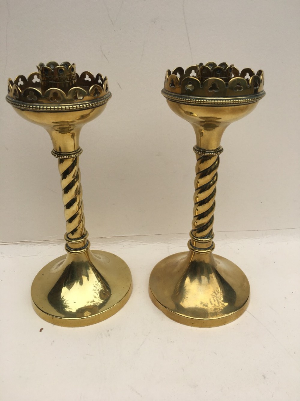 pair of brass gothic candlesticks