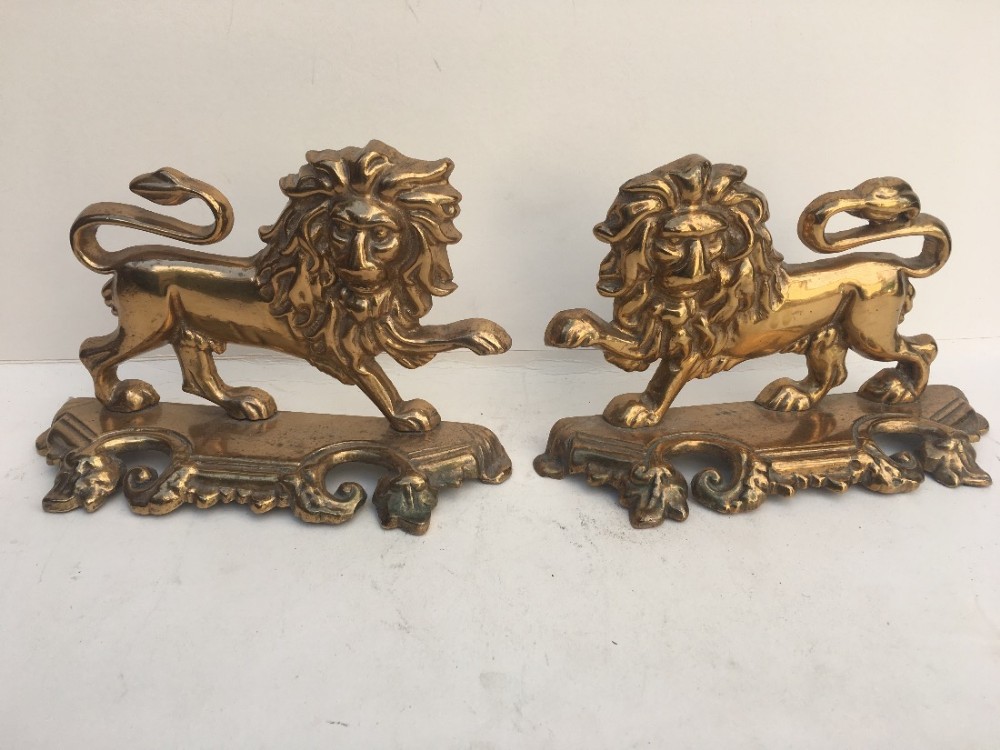 pair of c19th brass lion ornaments