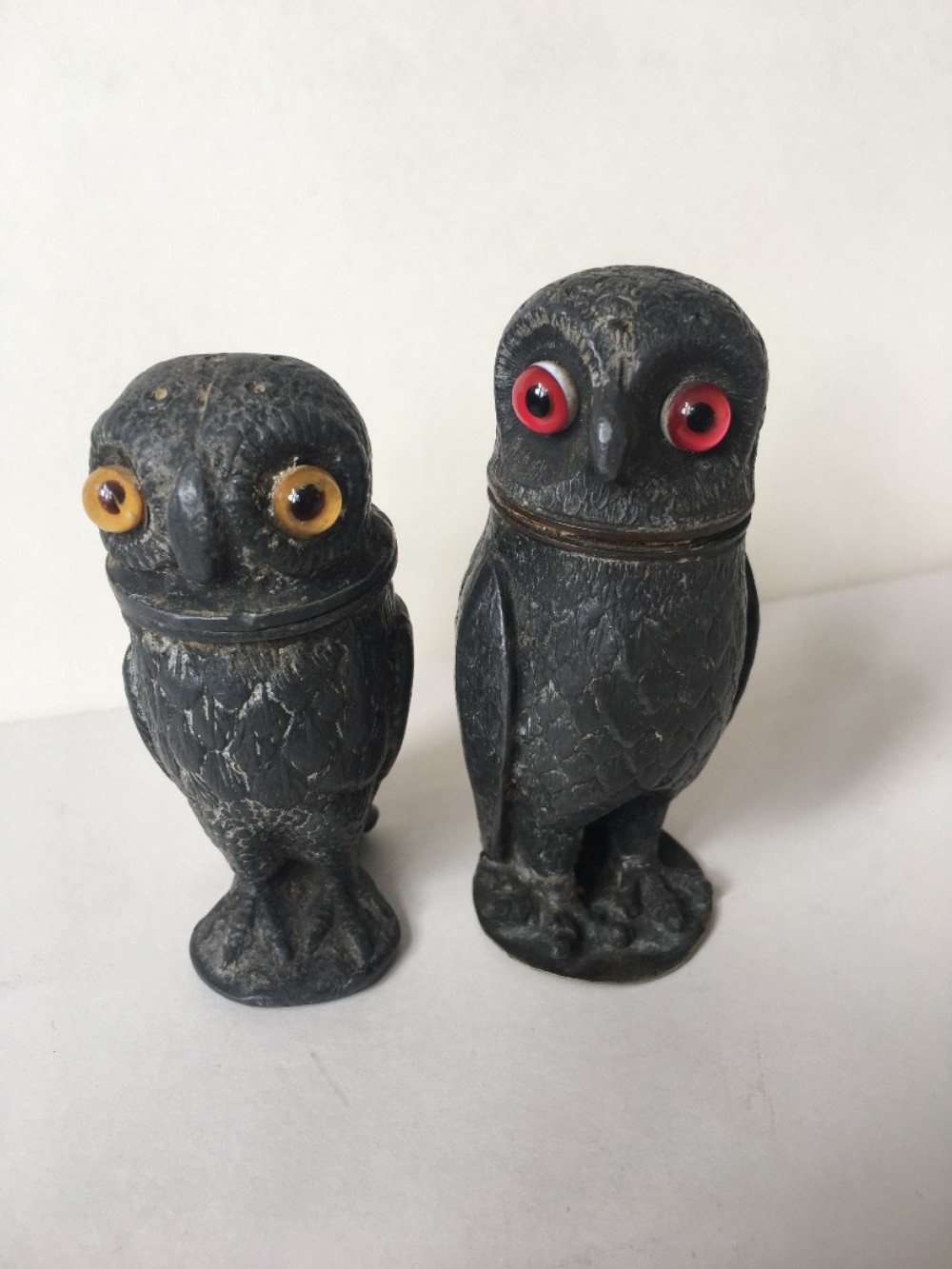two pewter pepper pots modelled as owls