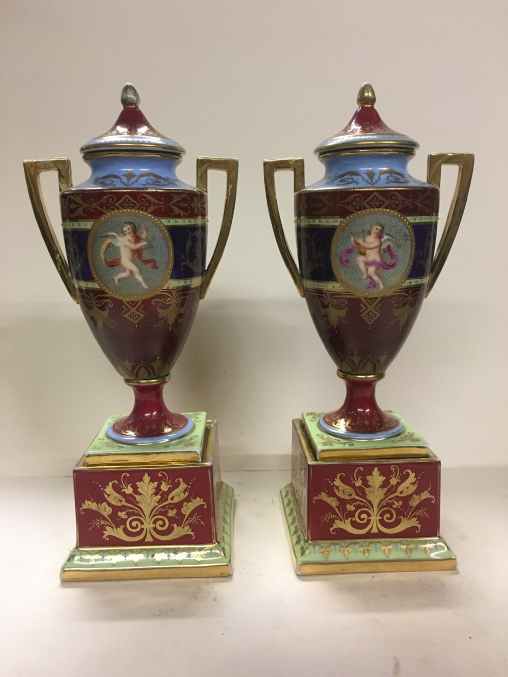pair of royal vienna urns on stands