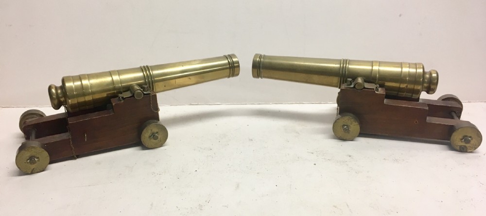 a pair of desktop model brass cannons