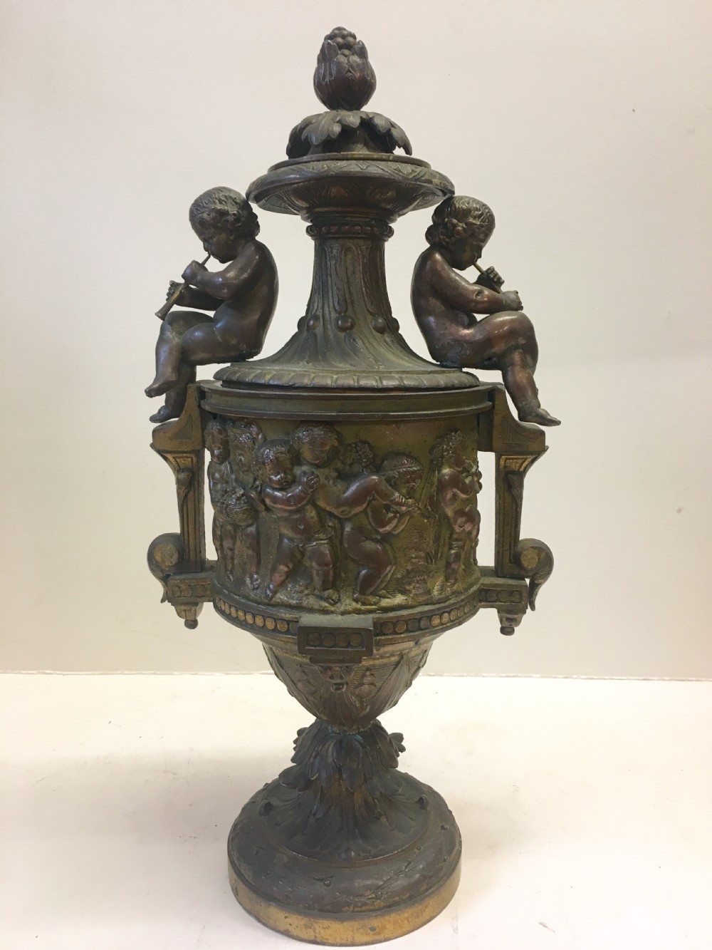 c19th gilt classical metal vase with cherub decoration