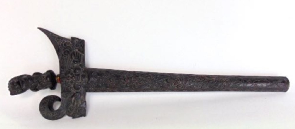 an eastern kris with carved case