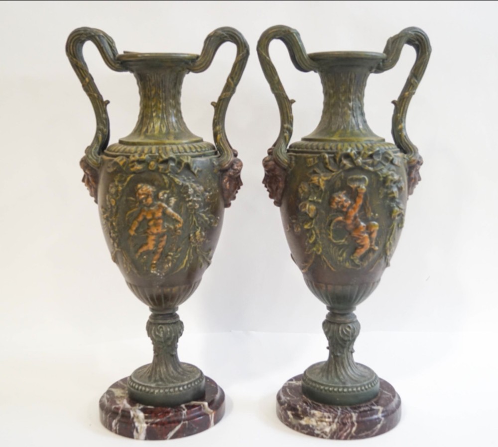 pair of painted spelter urns