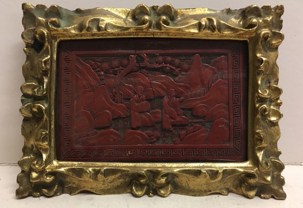 c19th cinnabar lacquered panel in carved gilt wood frame