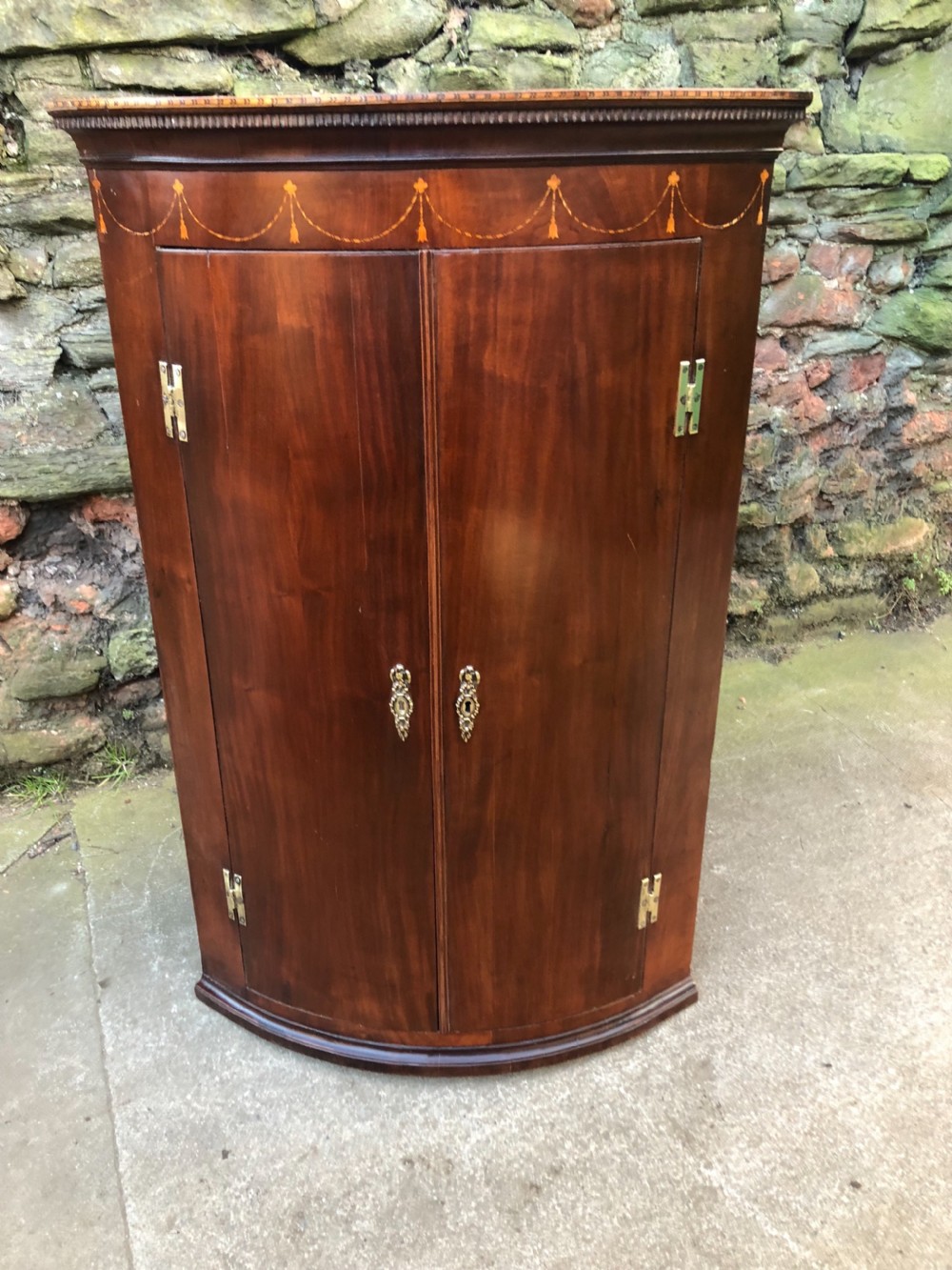 barrel fronted georgian inlaid corner cupboard