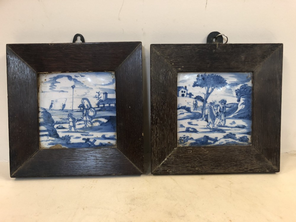 pair of c17th delft tiles in wooden frames