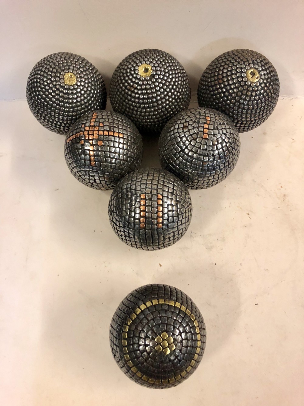 a collection of seven french ptanque boules