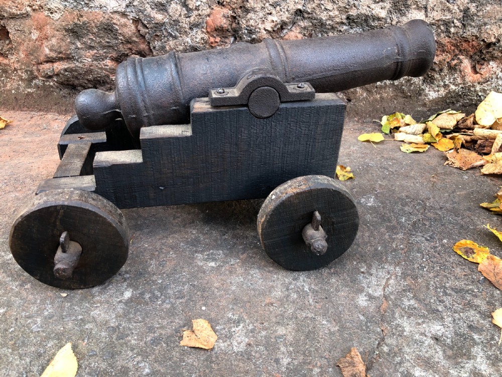 c19th small cannon on wood and cast iron stand