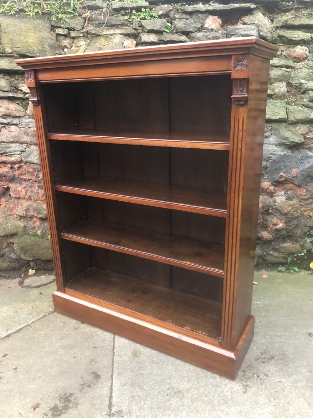 a victorian walnut bookcase with adjustable shelves