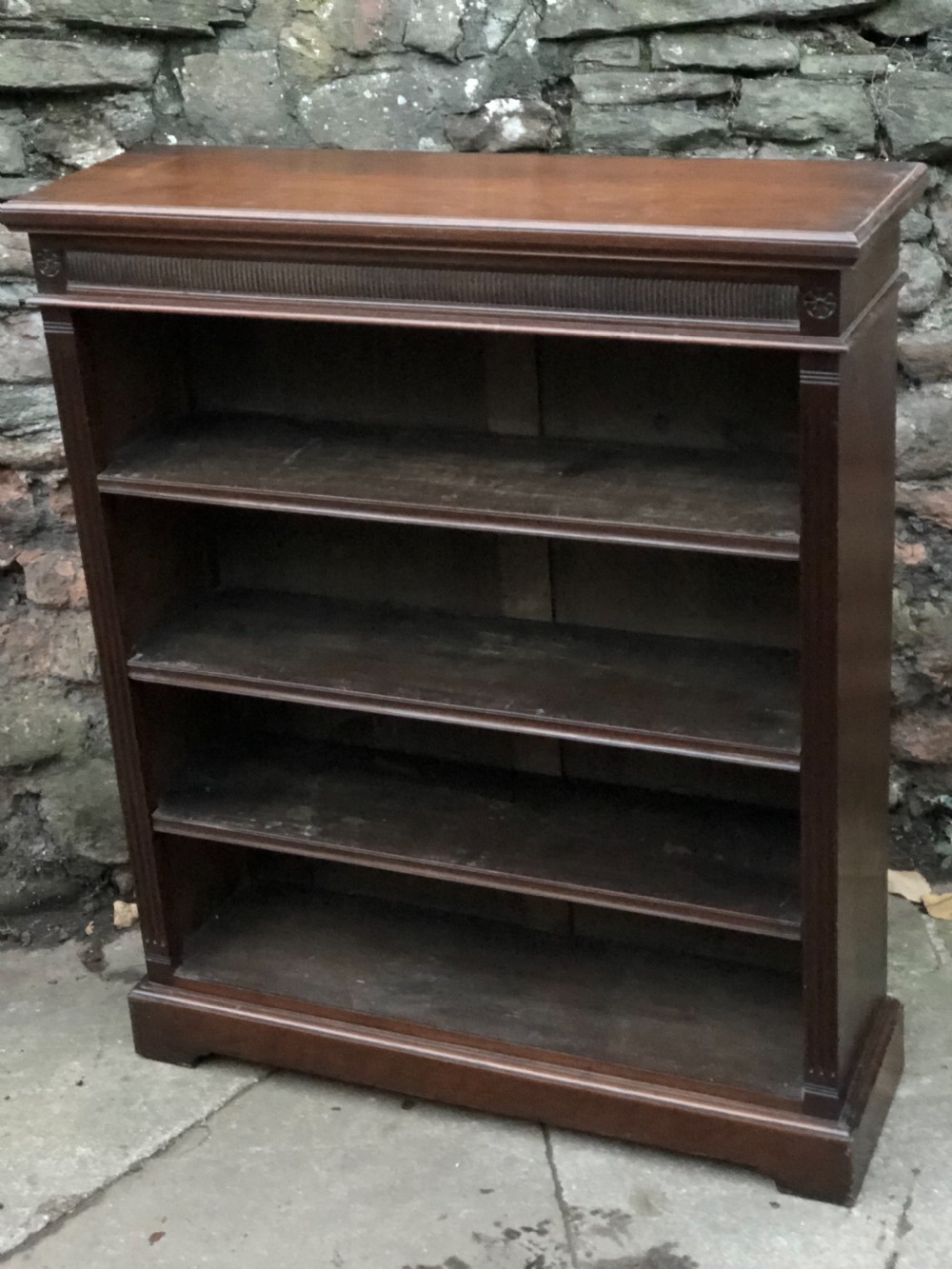 a small victorian walnut bookcase with three adjustable shelves