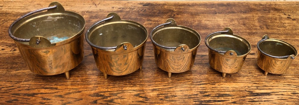 c19th graduating set of 5 brass cooking pans with feet