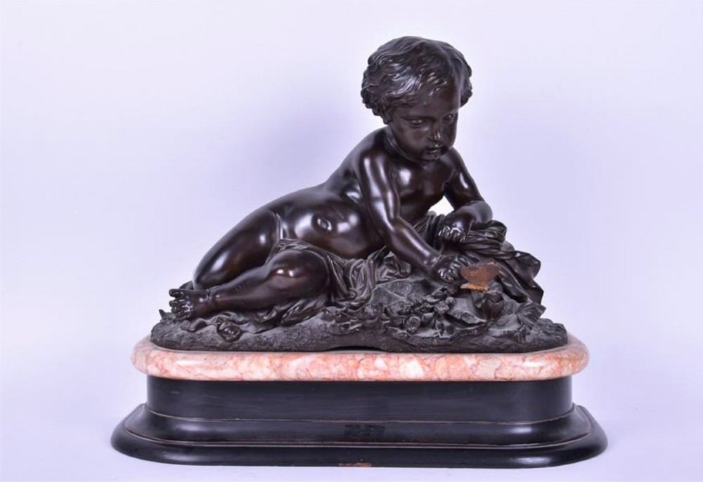 large c19th continental bronze of reclining cherub on marble base