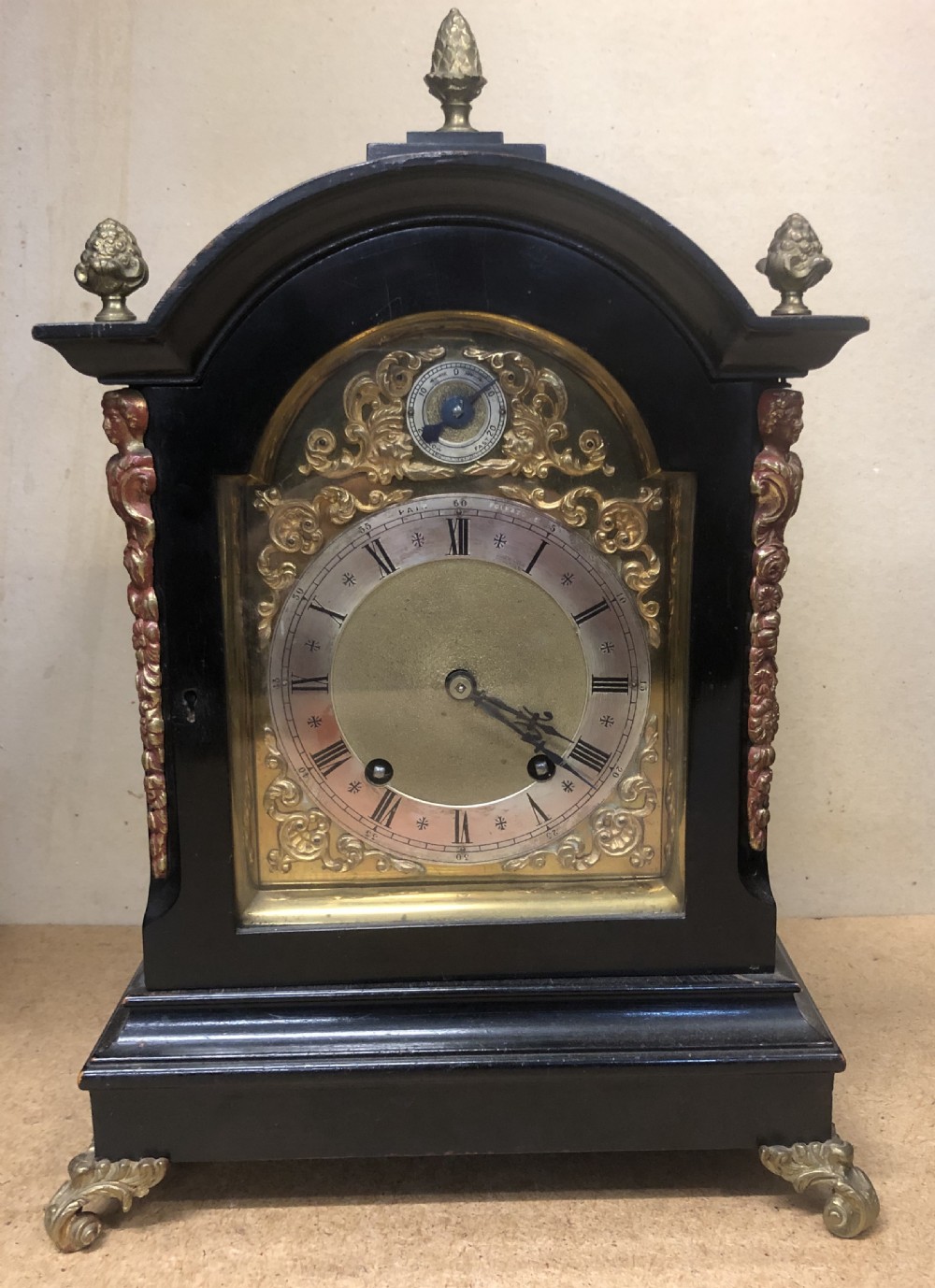 an ebonised georgian style bracket clock