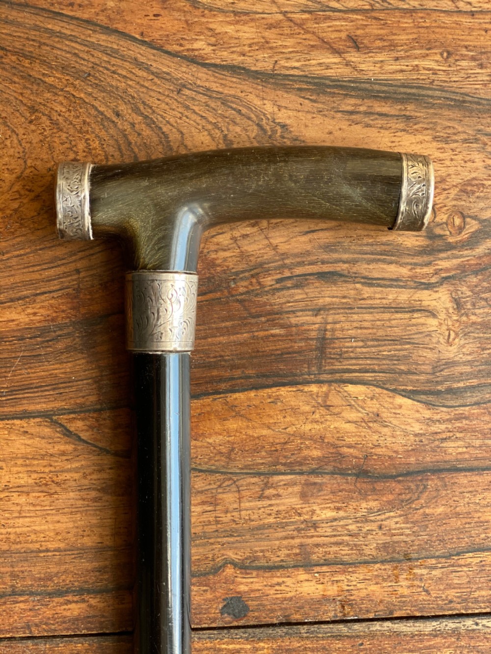 walking stick with bone and silver tipped handle