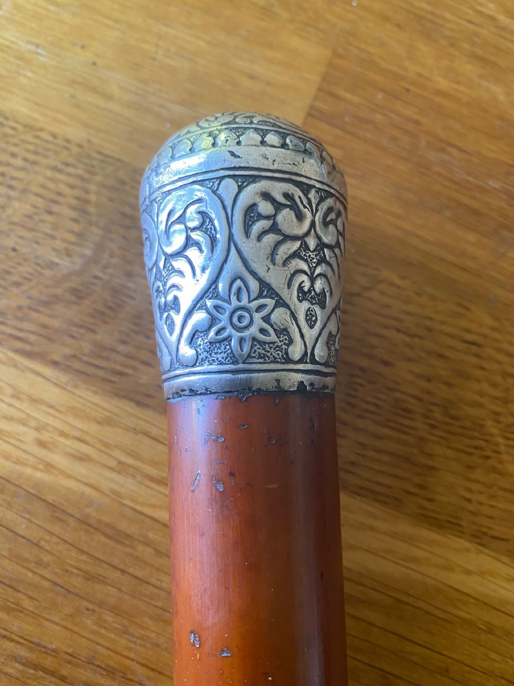 c19th white metal embossed topped malacca walking cane