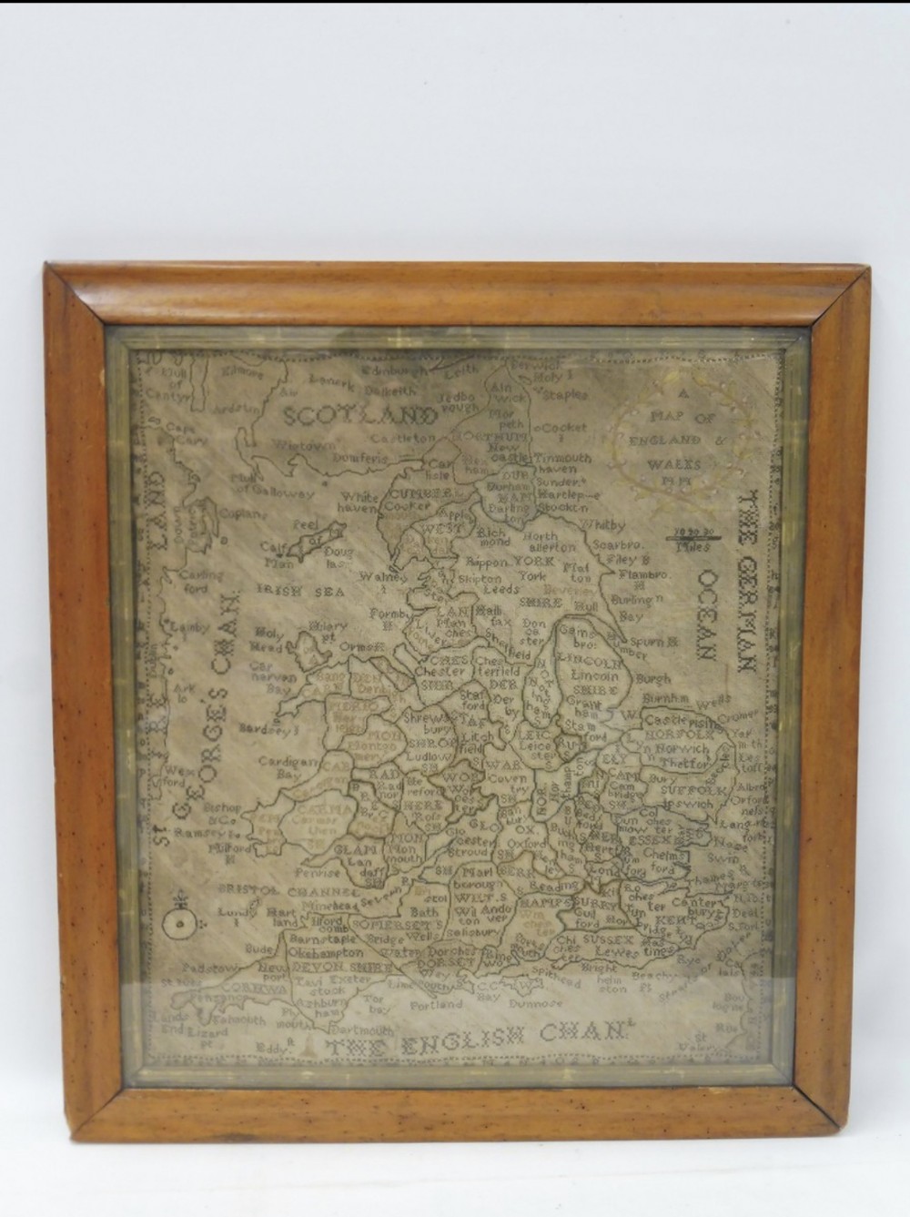 a fine c18th georgian map sampler in maple frame