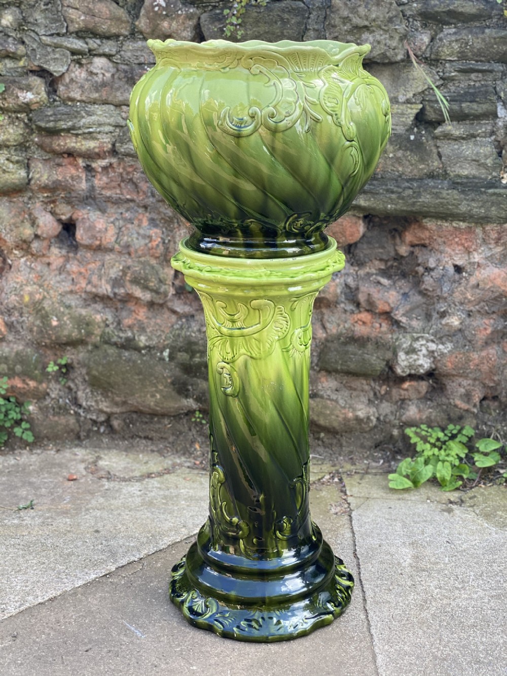 a victorian majolica green glazed jardinaire and stand