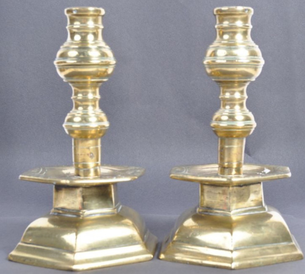 pair of early c18th heavy cast brass candlesticks