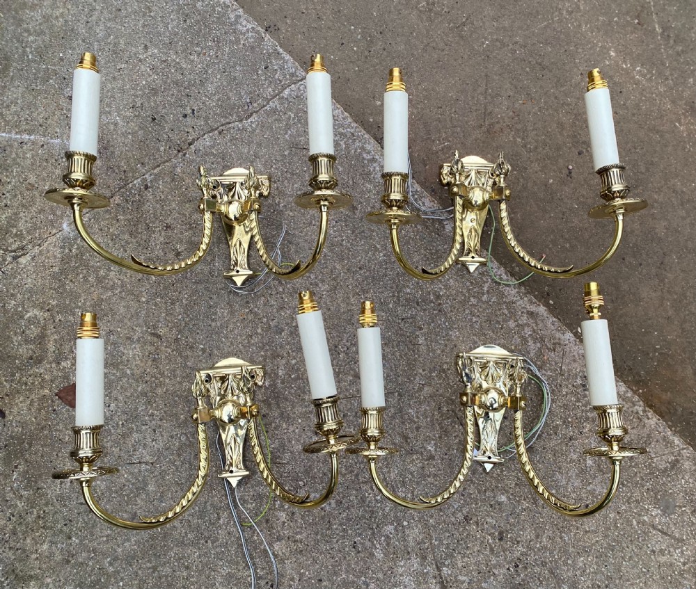 set of four edwardian brass twin armed wall lights