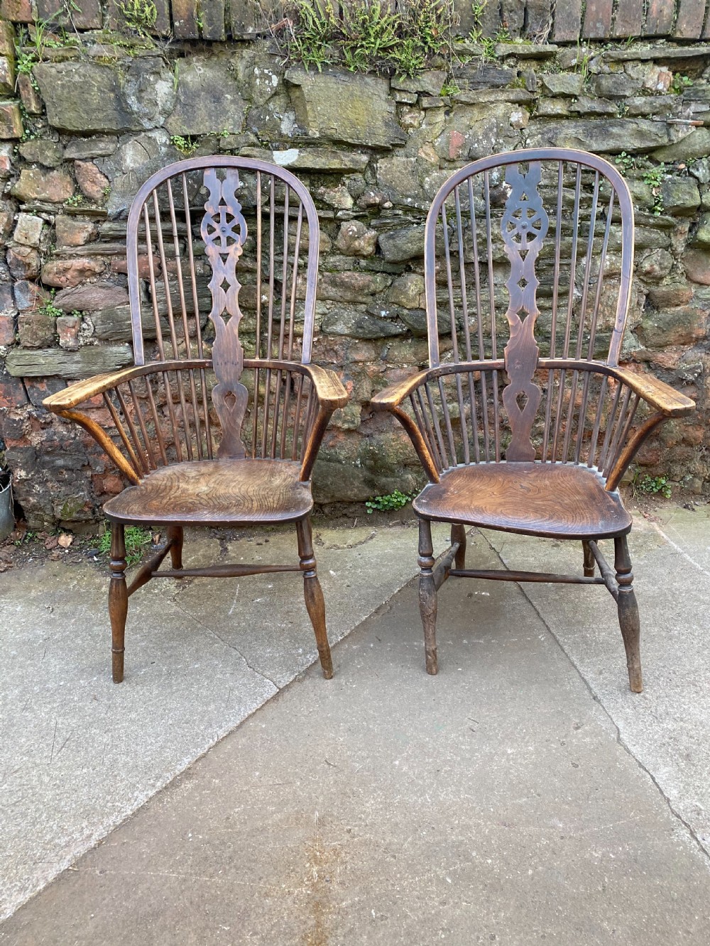 pair of c19th elm and beech tall hooped back wheel back chairs