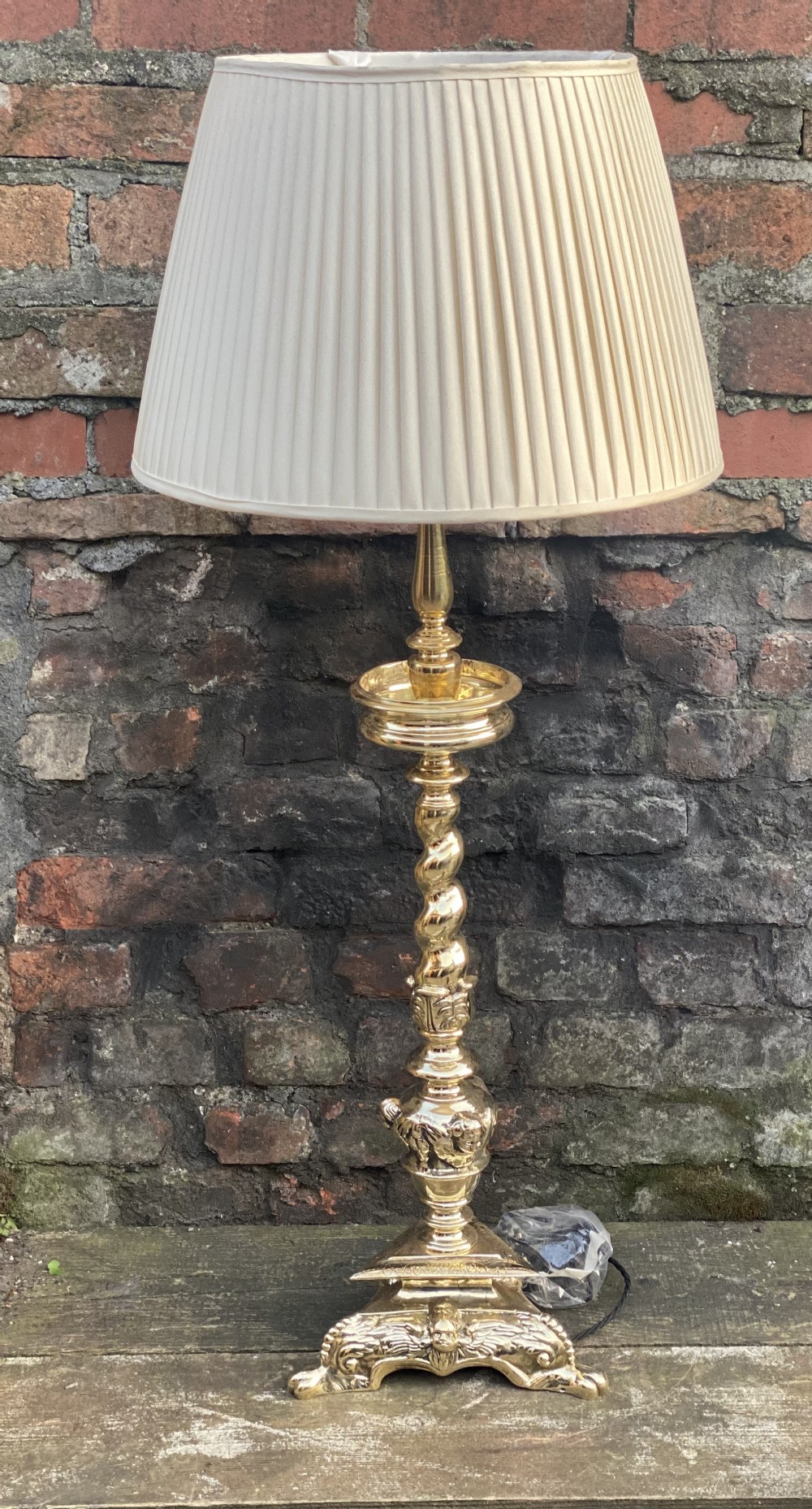 large table lamp in the c17th style with a cream silk shade