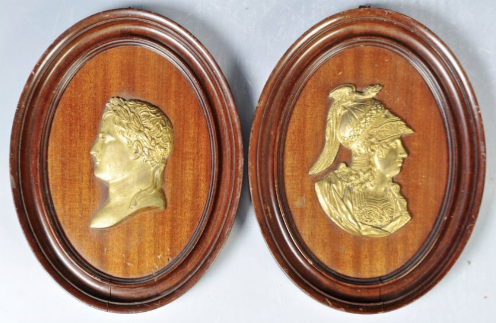 a pair of early c19th gilt bronze plaques of napoleon and alexander the great