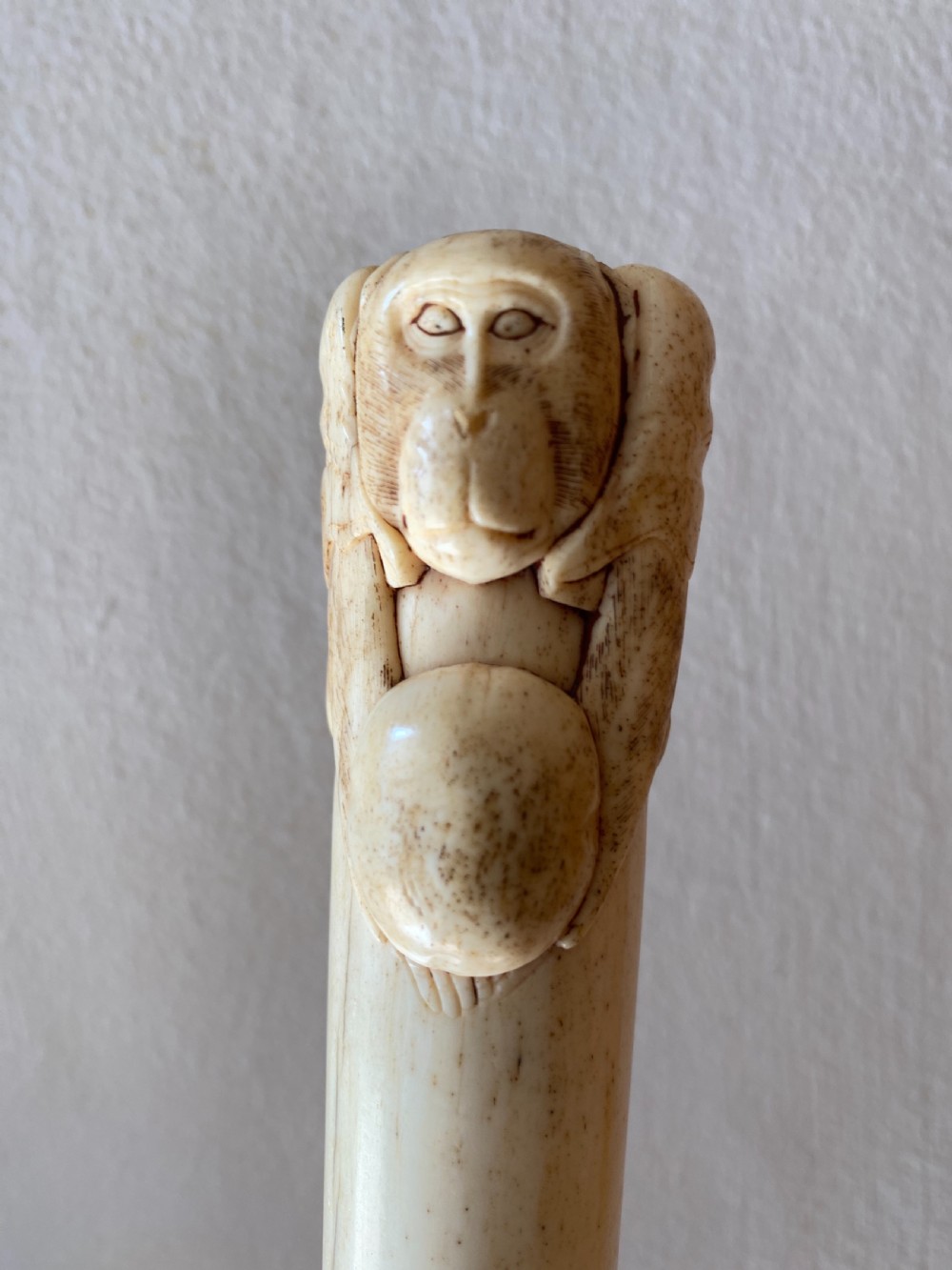 c19th chinese bone walking stick with carved monkey holding a ball
