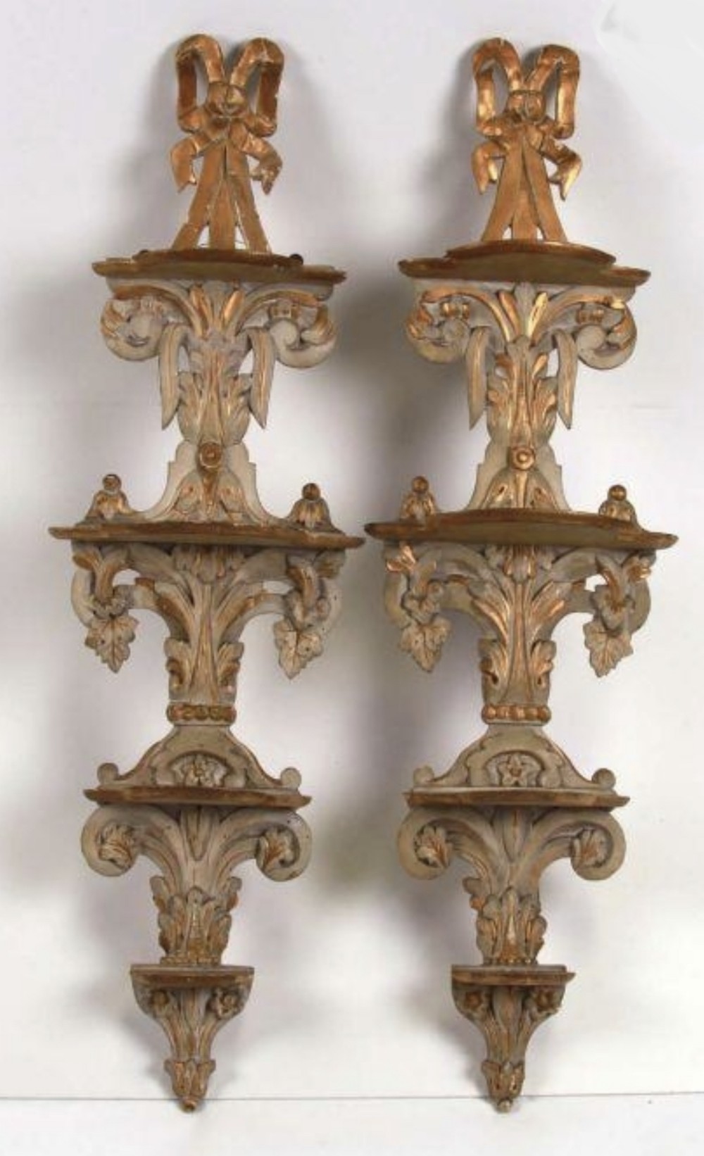pair of regency painted and gilded appliqu shelves