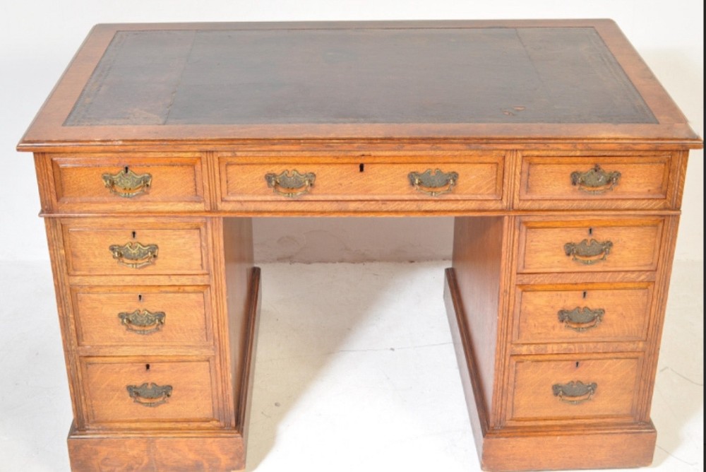 c19th oak pedestal 9 drawer desk