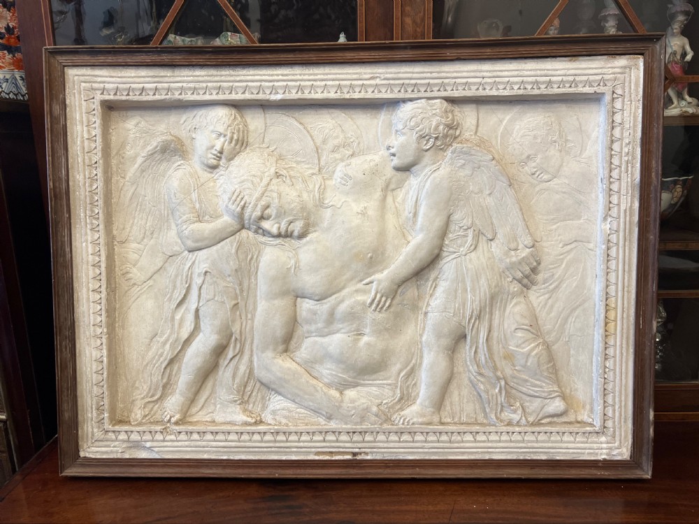 c19th plaster copy of the dead christ tended by angels by donatello c13861466
