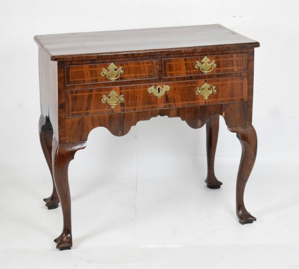 c18th walnut lowboy with cabriole legs and trilobe feet