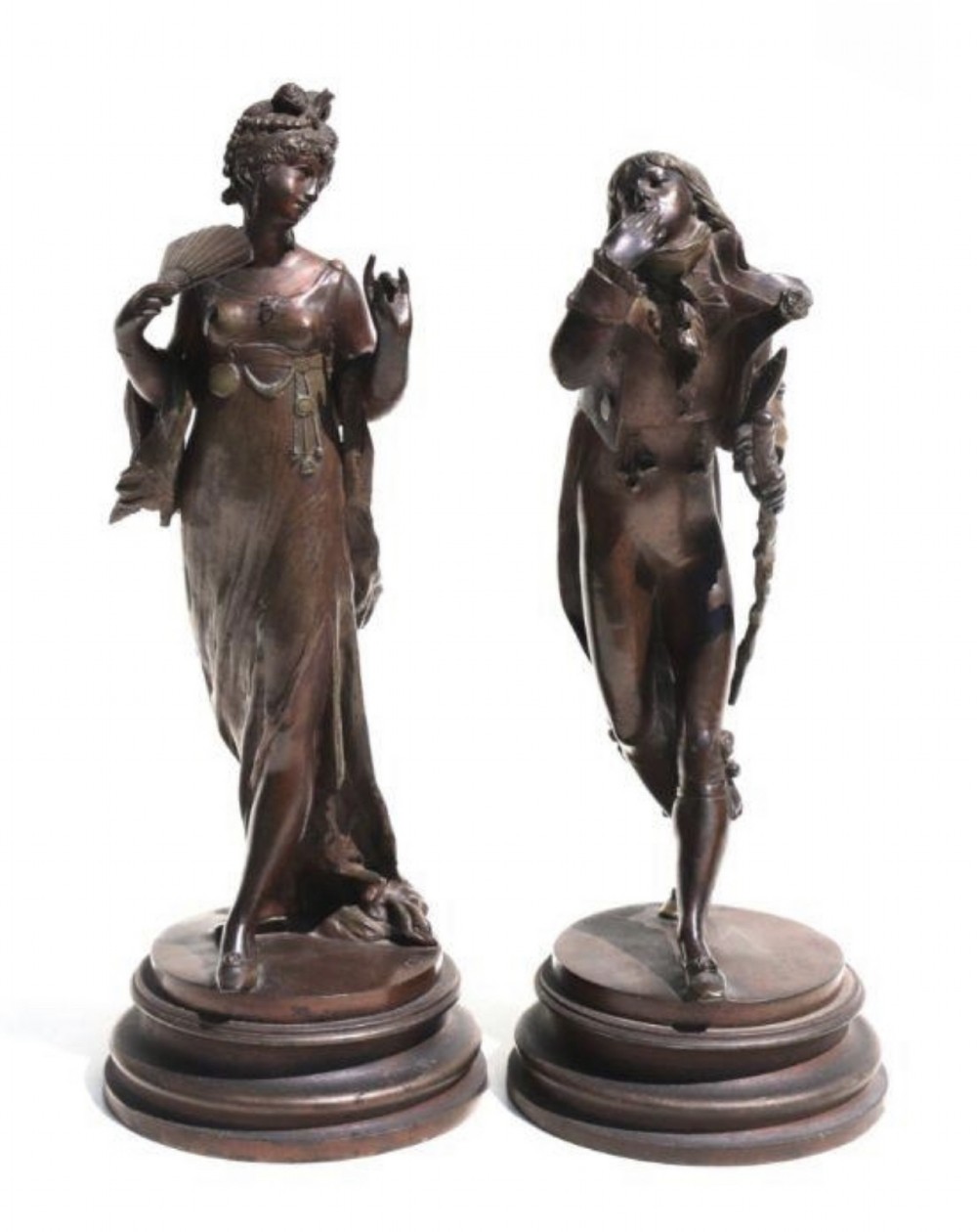 a pair of french bronzed spelter figures of a dandy and his beau
