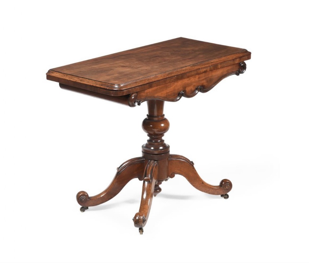 c19th mahogany tea table with four swept legs and carved detailing