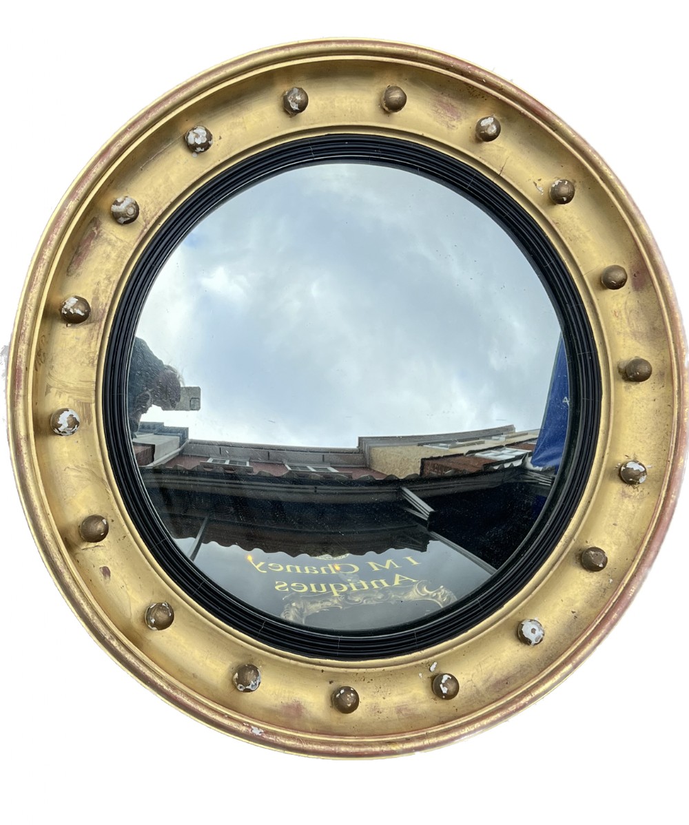 c19th large giltwood convex mirror