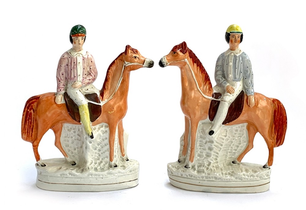 pair of c19th staffordshire jockeys on horseback