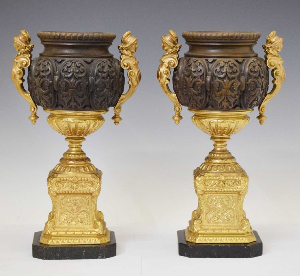 pair of french bronzed and ormolu urns on pedestals