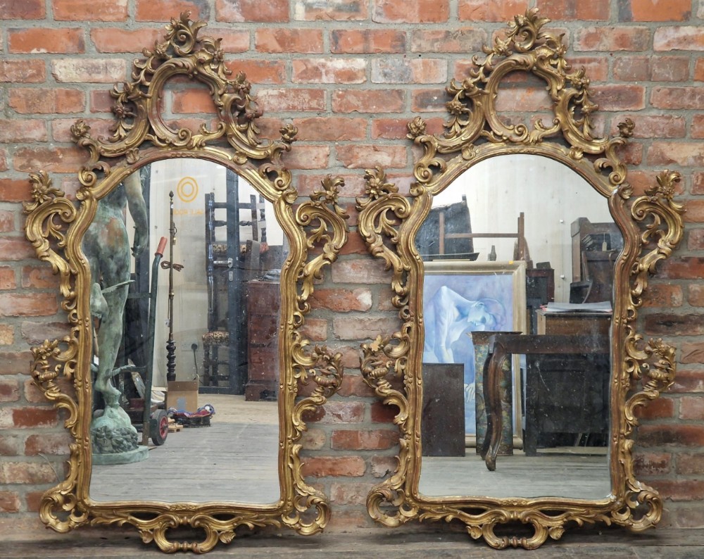 large pair of carved giltwood wall mirrors