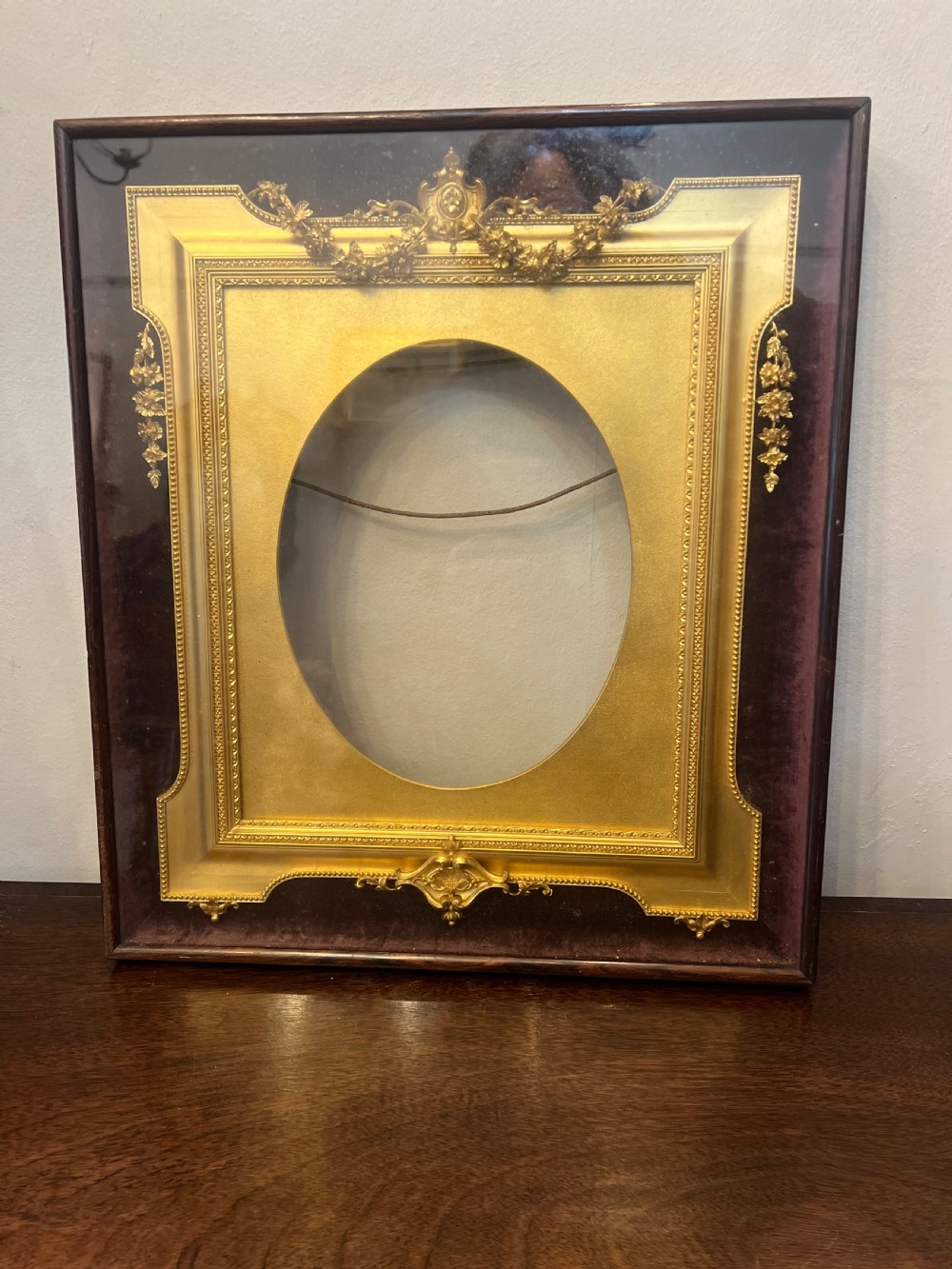 c19th gilt frame in glass case