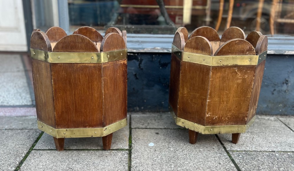 pair of stained pine and brass bound waste paper bins or log bins