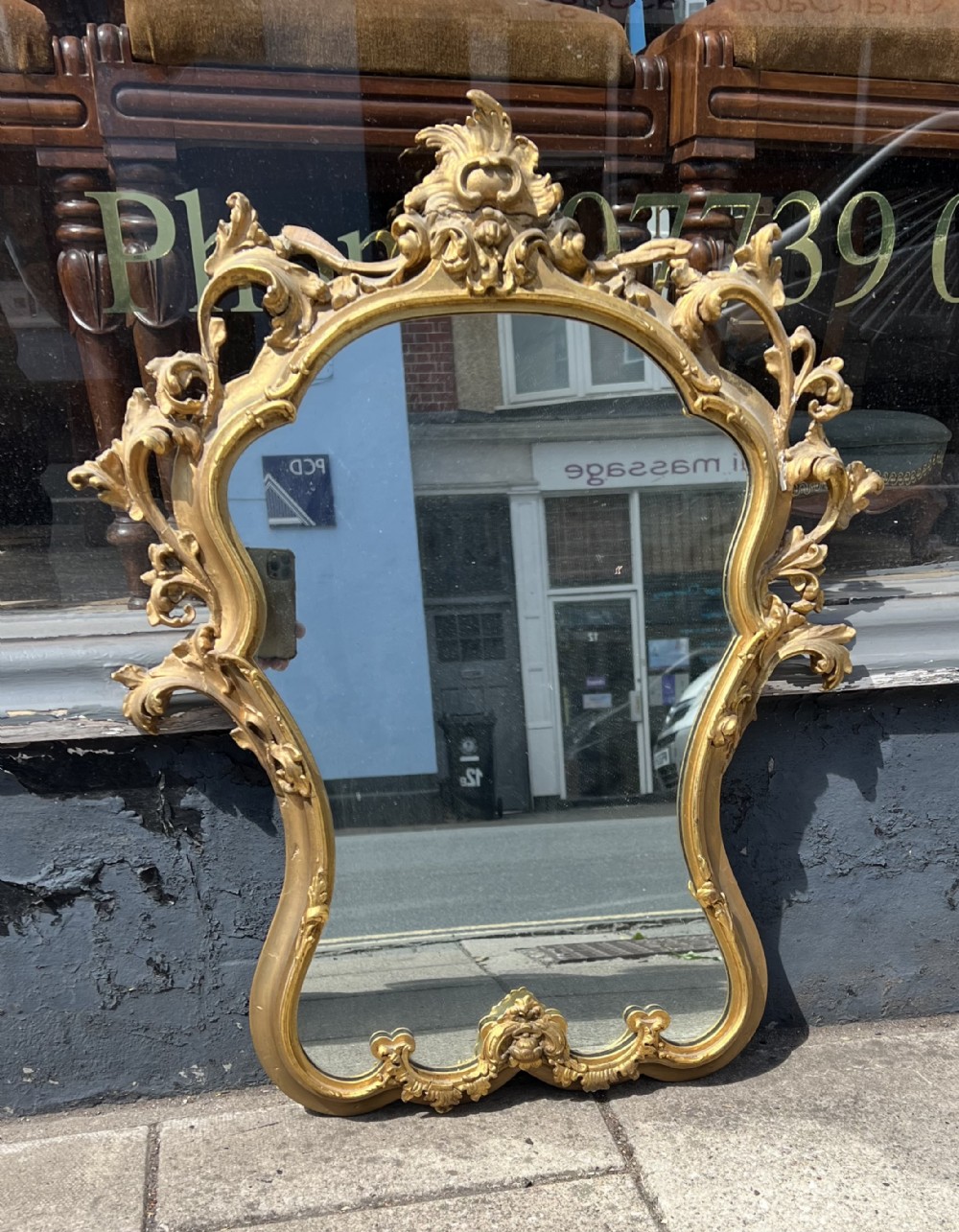 a gilded rococo style wall mirror
