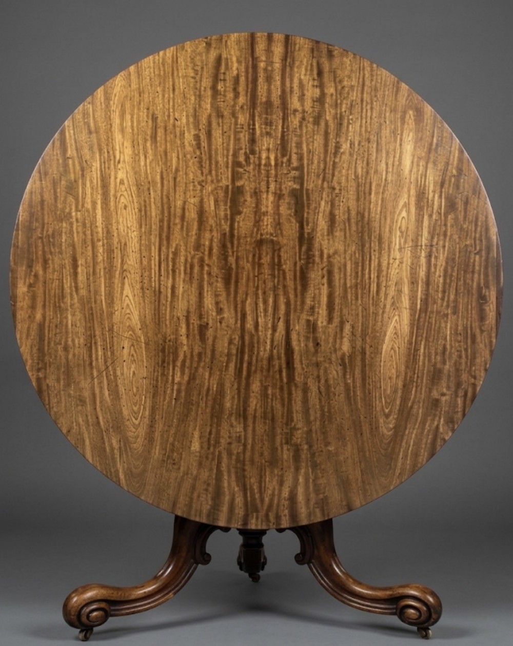 a large circular mahogany table